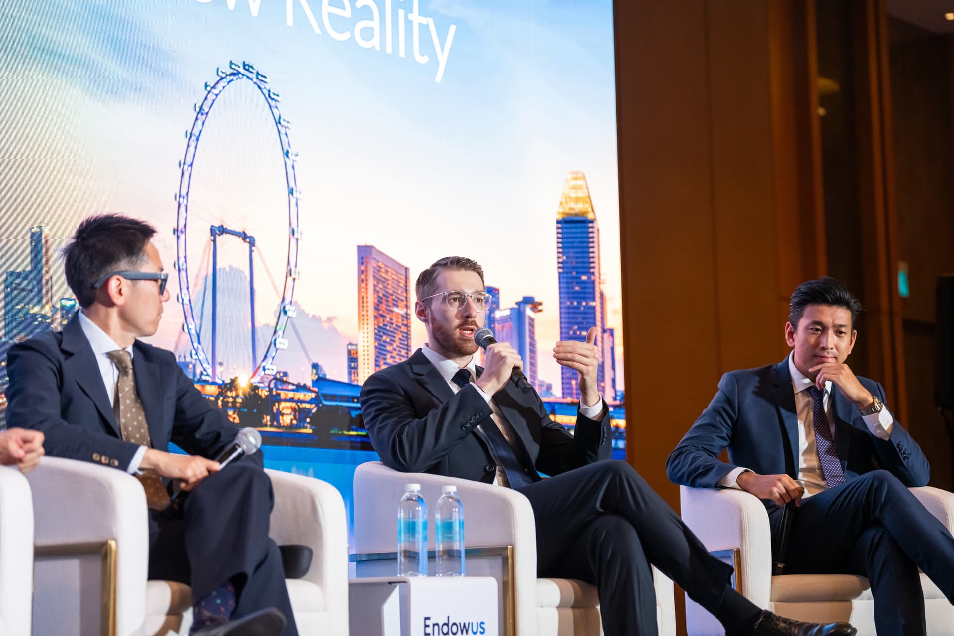 Michael Brenndoerfer speaking on a panel at Endowus Singapore