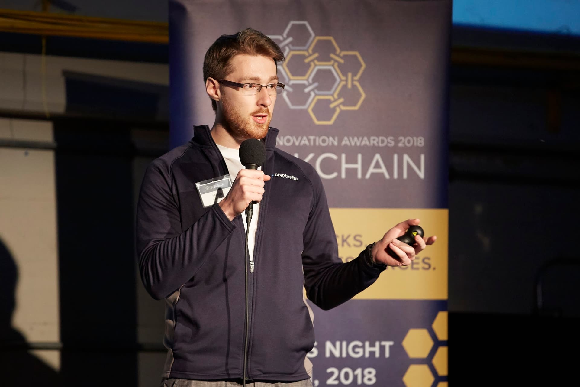 Michael Brenndoefer speaking on stage